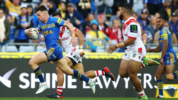 In the clear: Clint Gutherson sprints away to score one of his two tries.