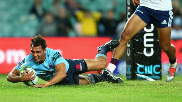 Shackles broken: Nick Phipps dives over to score against the Blues at Allianz Stadium.