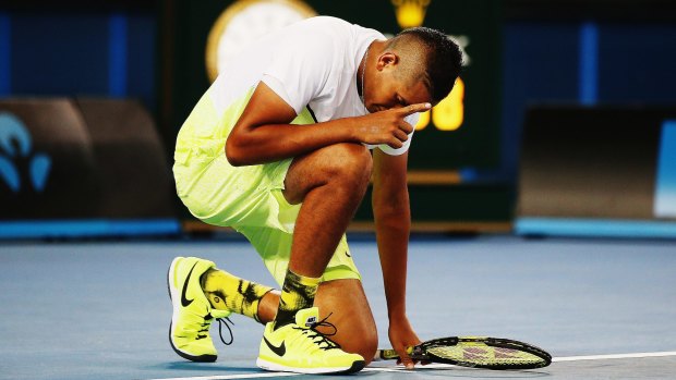 Nick Kyrgios takes a moment to remember his grandmother after winning the first round of the Australian Open.