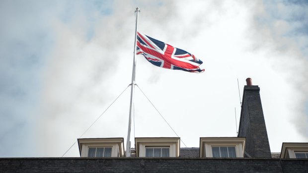 The Union flag flies at half mast in Downing Street on May 23, 2017 in London, England.