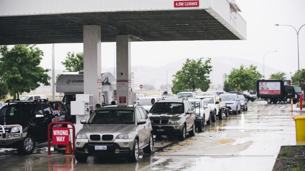 Cars line up for cheap fuel at Costco at Majura Park on Friday.