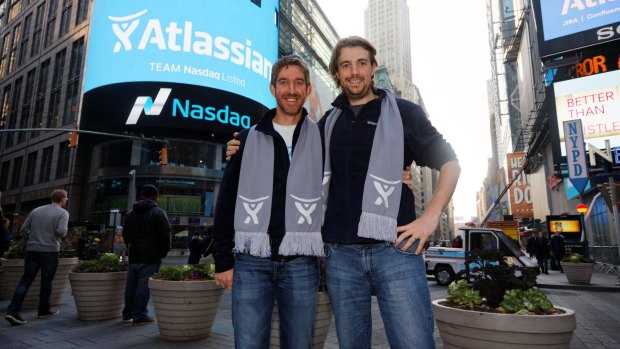 Mike Cannon-Brookes and business partner Scott Farquhar celebrate their Nasdaq listing.