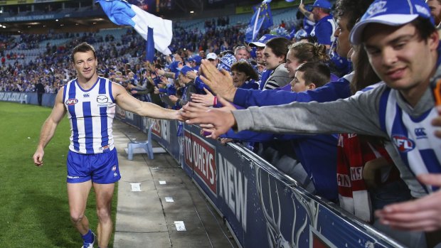 North Melbourne veteran Brent Harvey feels the love from supporters after the game.