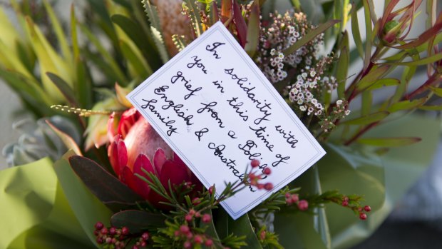 Flowers left at the front door of the French Embassy in Canberra.