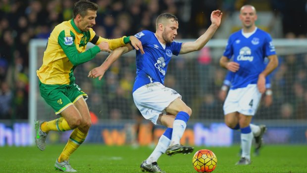 On the run: Tom Cleverley of Everton and Gary O'Neil of Norwich City compete for the ball at Carrow Road.
