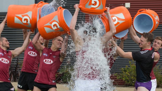 Copping a spray: Essendon forward Joe Daniher takes the ice bucket challenge.