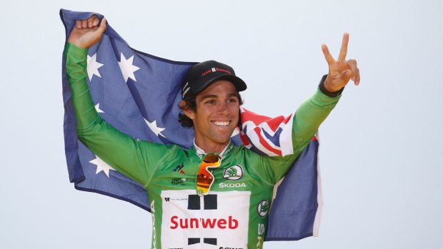 Australia's Michael Matthews celebrates after claiming the green jersey.