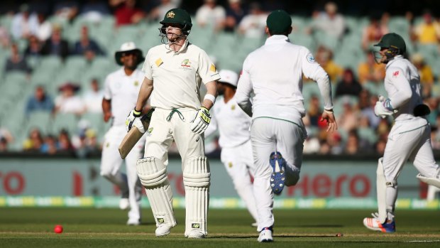 Mix-up: Steve Smith departs after a calamitous run-out.