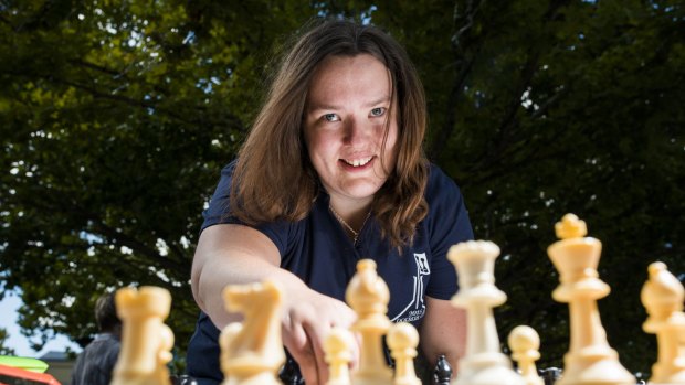 Alana Chibnall playing chess at the ACT Chess Association chess expo in Garema Place.