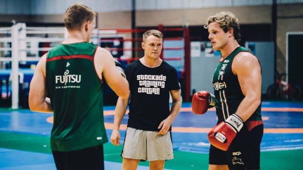 Canberra boxer Dave Toussaint is doing a boxing session with South Sydney Rabbitohs players at the AIS. Dave Toussaint with Rabbitohs George Burgess. Photo: Jamila Toderas