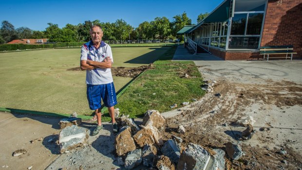 Bob Powell, president of the Canberra City Bowling Club, watched a bobcat tear up the green, marking the club's closure.