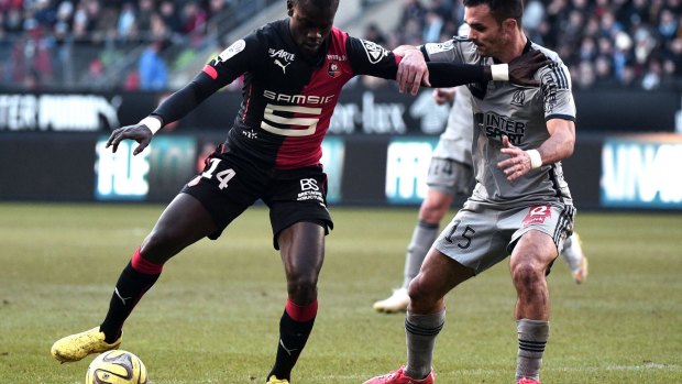 In control: Rennes' Fallou Diagne vies with Marseille's Jeremy Morel.