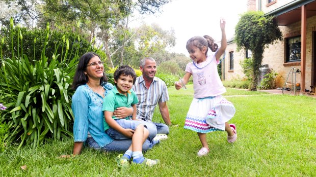 Canberra GP Rashmi Sharma, at home with her family, from left, Rishabh Archer-Sharma, 4, Stuart Archer and Anuradha Archer-Sharma, 3. 