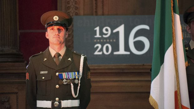 An Irish soldier stands guard in Dublin where the city is preparing for the centenary of the 1916 Easter Rising.