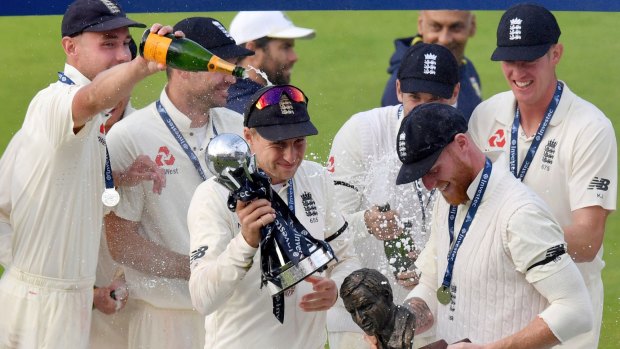 England captain Joe Root is doused with champagne after the series win over South Africa.