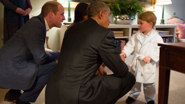 Prince George shakes hands with President Obama at Kensington Palace.