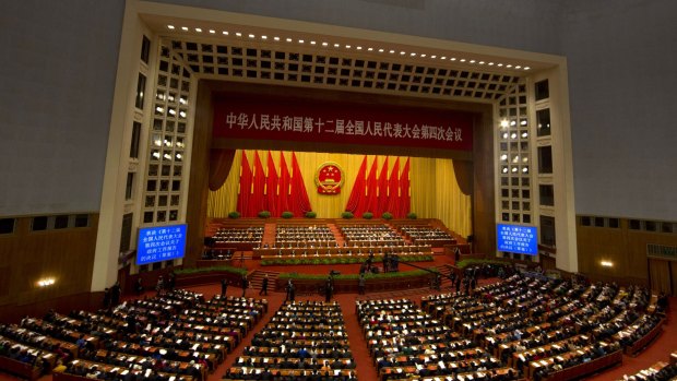 Delegates attend the close of the annual National People's Congress in Beijing's Great Hall of the People.