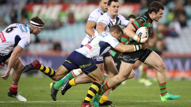 In form: Young Rabbitoh Angus Crichton charges through the Titans' defence.