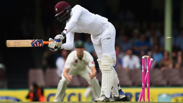 Skittled: Australian paceman James Pattinson rattles the stumps of West Indian batsman Carlos Brathwaite.