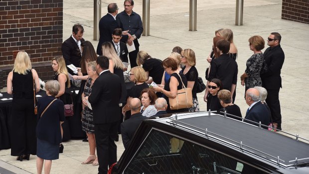 Mourners arrive at St Mary's Catholic Church for the funeral of Annabelle Falkholt and her parents Lars and Vivian Falkholt. 
