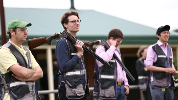 Journalists, including, Matthew Knott (second from left), during clay target shooting in Canberra.