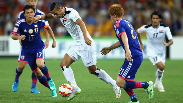 Dynamic: Ali Adnan Kadhim of Iraq takes on the Japanese defence in Brisbane.