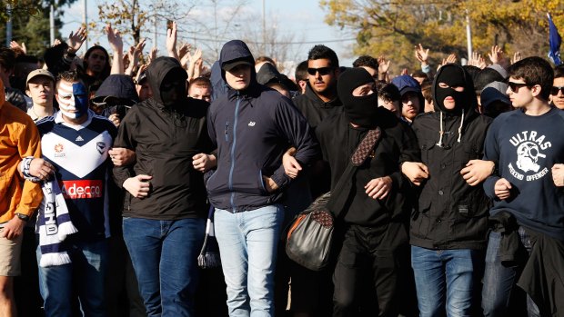 Aggressive Melbourne FC fans arrive at the A-League grand final at AAMI Stadium.