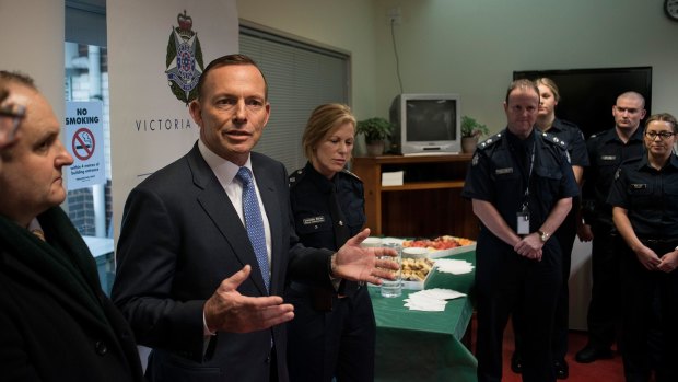 Former prime minister Tony Abbott discusses counter terrorism with Victoria Police and the AFP at Endeavour Hills Police Station in Melbourne in June.