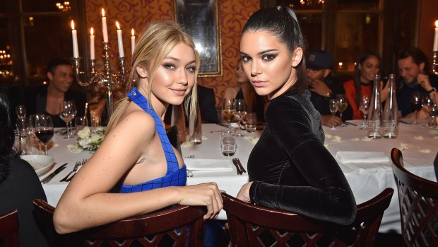 Gigi Hadid and Kendall Jenner attend the Balmain Aftershow Dinner as part of the Paris Fashion Week last month.