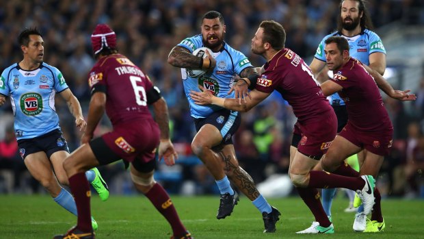 On the charge: Andrew Fifita surges into the Queensland defence during Origin II.