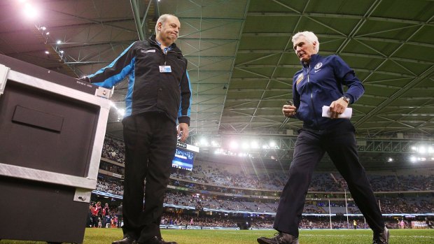 Blues coach Mick Malthouse leaves the field at the start of the third quarter.