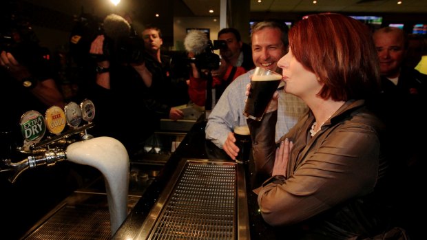 Julia Gillard sips a Tooheys Old during the 2010 campaign.