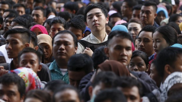 Sluggish economy: young Indonesians  at a jobs fair in Jakarta this week.