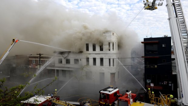Firefighters battle the blaze engulfing the Albion Hotel on October 5.