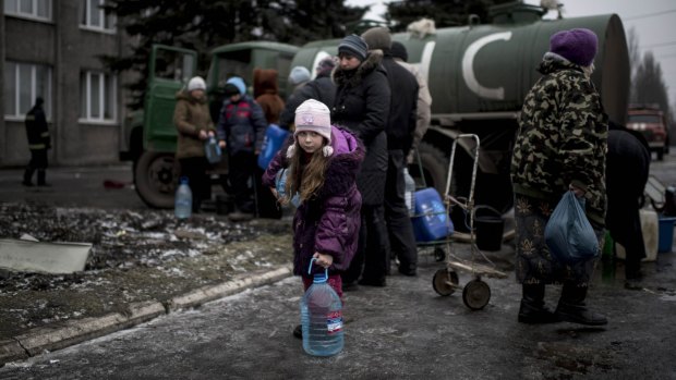 A girl holds a water bottle in Debaltseve, eastern Ukraine.