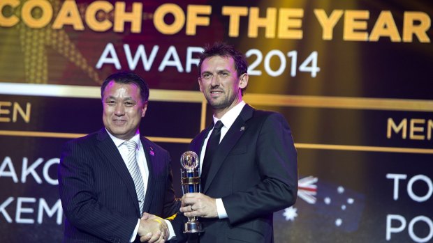 Big in Asia: Wanderers boss Tony Popovic receives the AFC Coach of the Year award from AFC technical committee chairman Kozo Tashima.