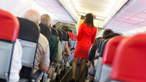 A man is claiming 'reverse discrimination' over being banned for life from an airline after allegedly touching a flight attendant's buttocks.