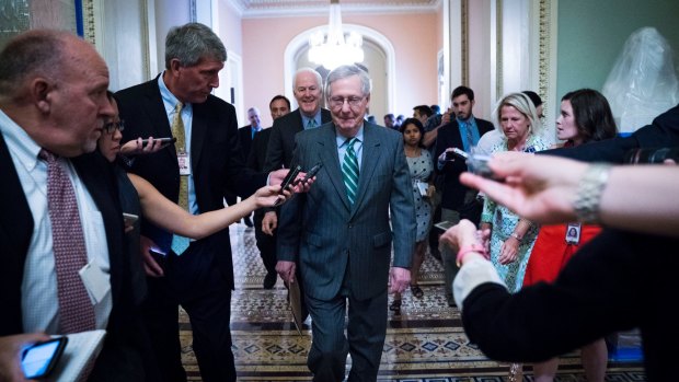Senate Majority leader Mitch McConnell, centre, is under pressure from both wings of his party and can only afford two defections as he seeks to pass a health bill to replace Barack Obama's Affordable Care Act.