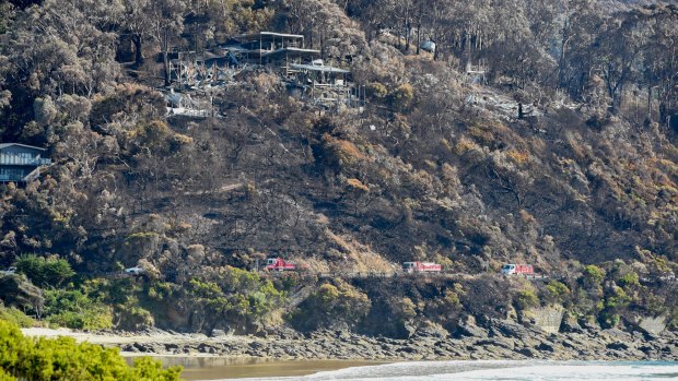 The Great Ocean Road will be fully opened from Wednesday. Earlier, fire trucks snake along the Great Ocean Road near Wye River. 