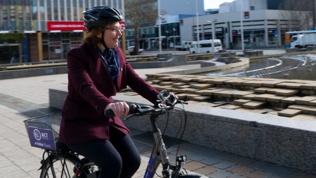 Transport minister Meegan Fitzharris rides a bicycle in Civic Square as part of a push to get more women on bikes.