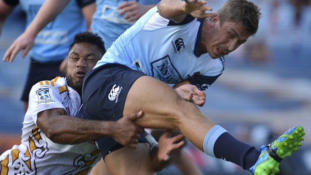 Caught: Harry Jones kicks during the Super Rugby trial match between the Chiefs and the Waratahs at Rotorua International Stadium on Friday.
