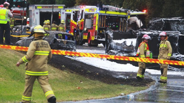 Firefighters at the scene of the Mona Vale crash that left two people dead. 