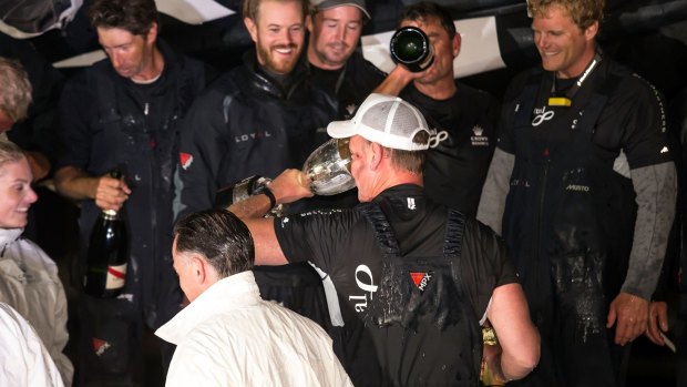 Perpetual LOYAL owner/skipper Anthony Bell celebrates with sponsors and crew at Constitution Dock after winning the 2016 Sydney To Hobart.