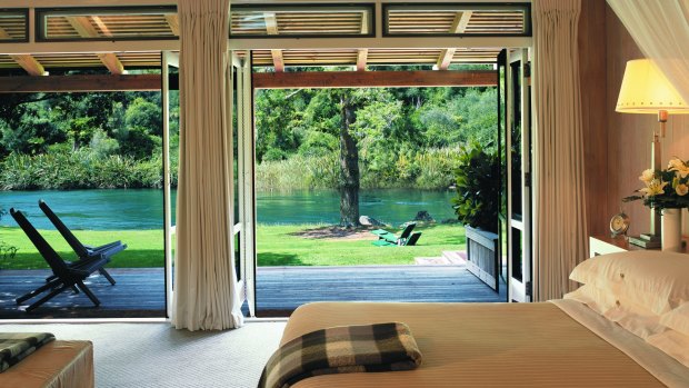 A suite  at Huka Lodge opens on to the riverbank.