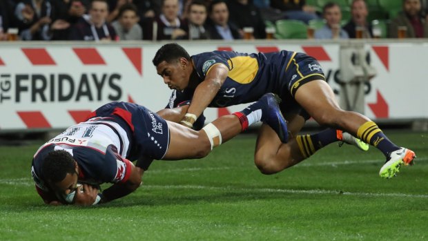Sefa Naivalu of the Rebels scores a try.