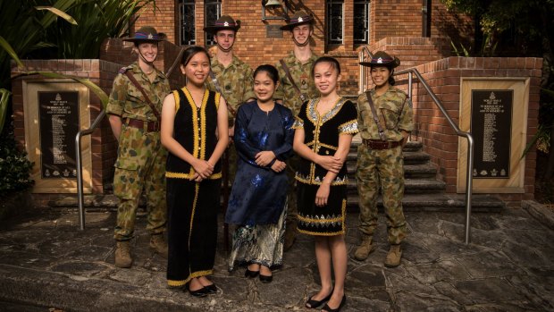 Genevia Handry (front left to right), Agnes Jackson and Suzie Binti Aitor from Borneo are a living memorial to the men who died in the Sandakan death marches. They are studying at Barker College with (from left)  Lauren Bright, James Meek, Campbell Jones and Suzie Saltor.
