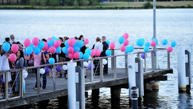 Family and friends gathered at the jetty near the National Museum to release balloons for Cathy Marsh.