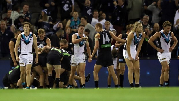 Highs and lows: Blues and Port players had different reactions on the final siren.