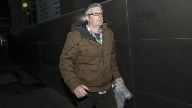 Disgraced builder Andrew McMahon leaves the Melbourne Magistrates Court on Wednesday. 