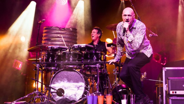 Midnight Oil performing in Brisbane last month.